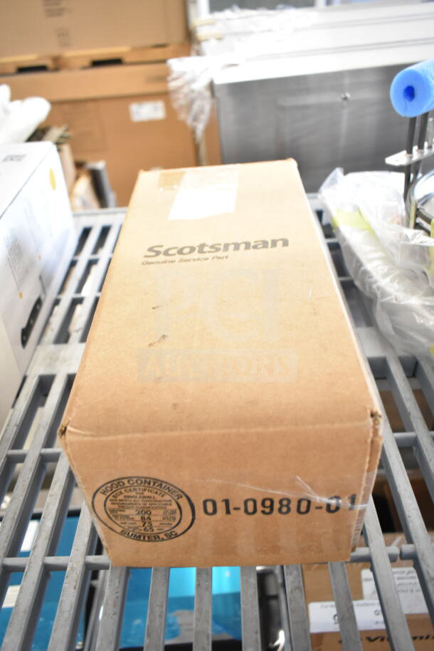 Brown box with label showing "Scotsman Genuine Service Part," containing Scotsman A32588-020 Pump. Box is sealed.