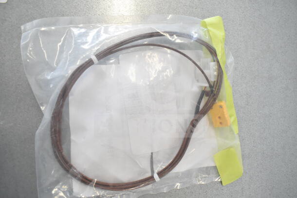Package containing Lincoln 370358 Thermocouple, new condition, in clear plastic bag with yellow label.