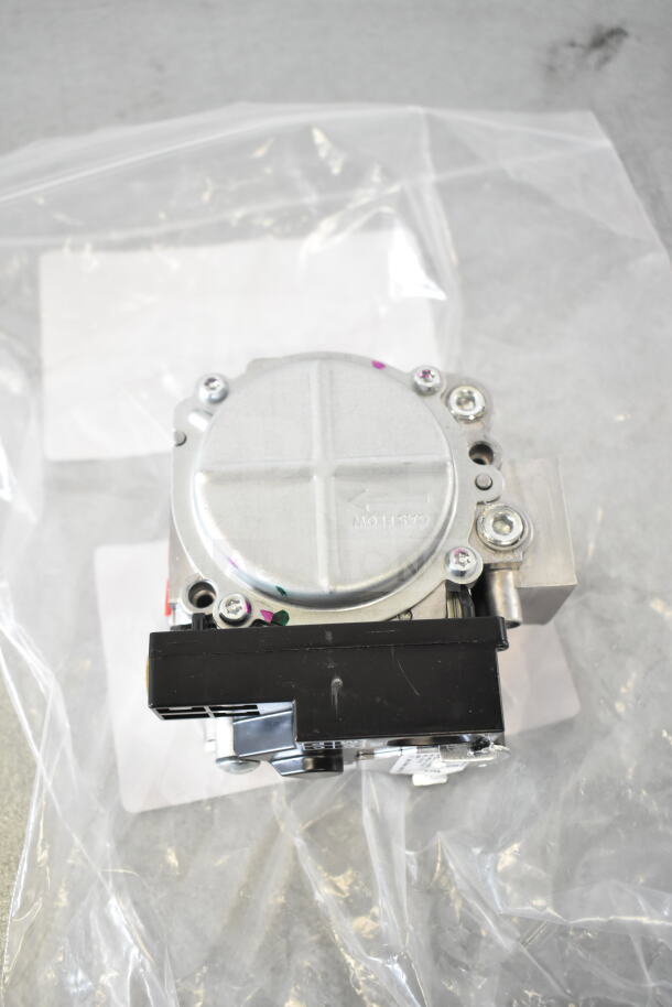 Brand new Moffat gas valve, model M234458, in plastic packaging. Features silver metal casing and black connector.