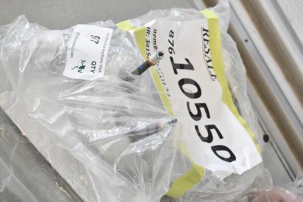 5 brand new scratch and dent items in plastic wrapped bundles with visible auction tags showing item number 10550.