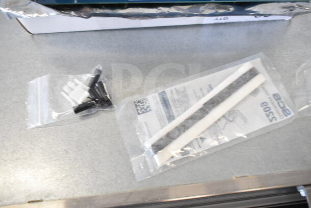 Brand new Zumex 07902 shredder disc, Lincoln CK11010005780 control board, Aviva 3-chamber dispenser, and Vollrath pusher head.