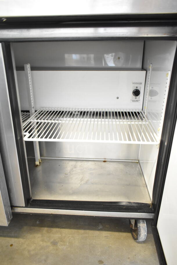 True TUC-72 commercial 3-door undercounter cooler on casters, 115 volts, 1 phase, spacious interior, used condition.
