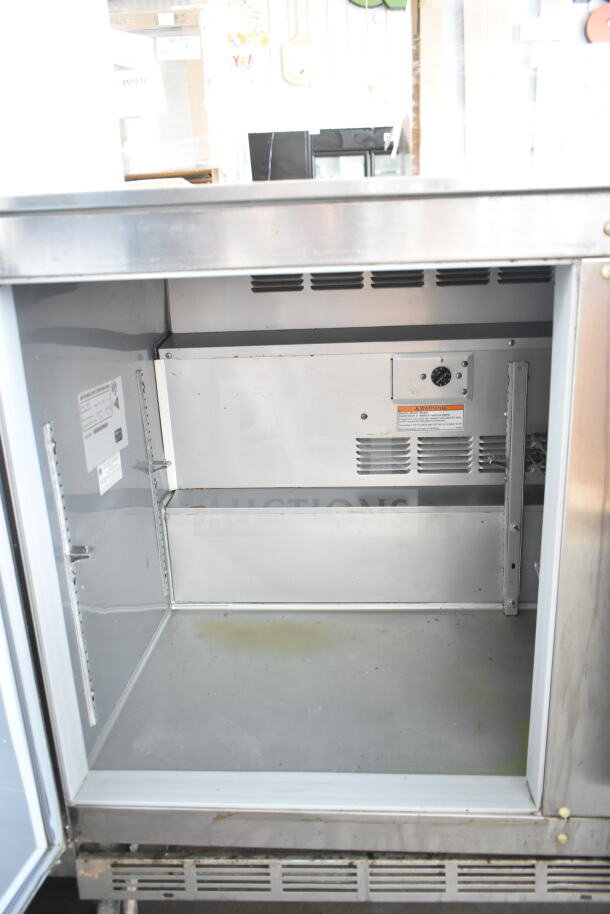 Beverage Air UCR48A commercial undercounter cooler with two doors, visible interior, on casters, 115 volts, 1 phase.