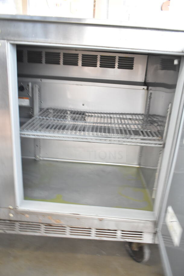 Beverage Air UCR48A commercial cooler, 2-door, undercounter, with commercial casters, 115V, 1 phase, open view.