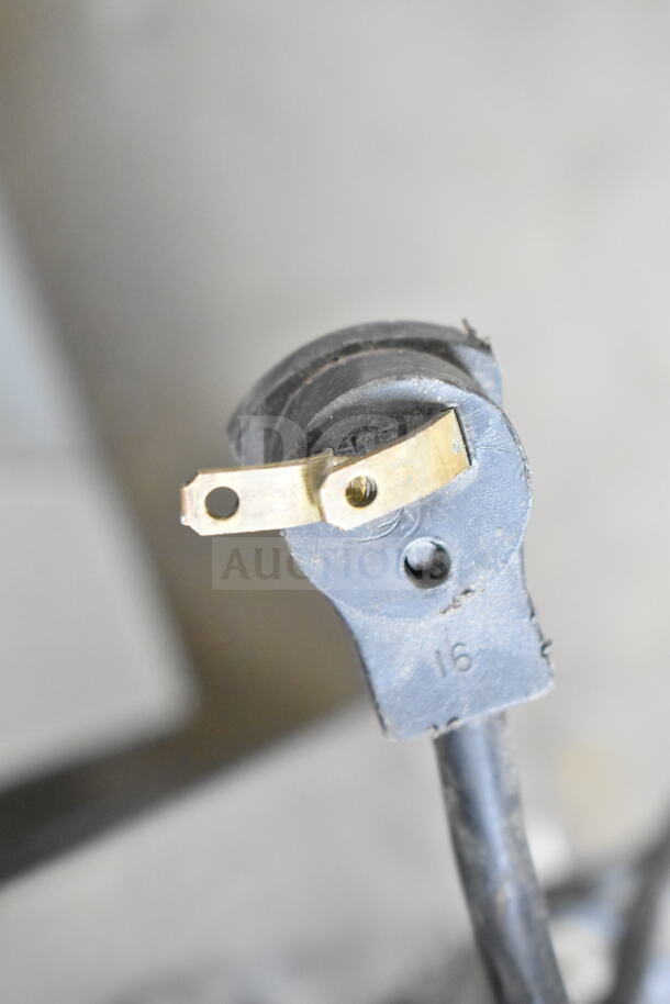 Beverage Air UCR48A commercial cooler plug, 115 volts, 1 phase, showing electrical prongs and part of a cord.