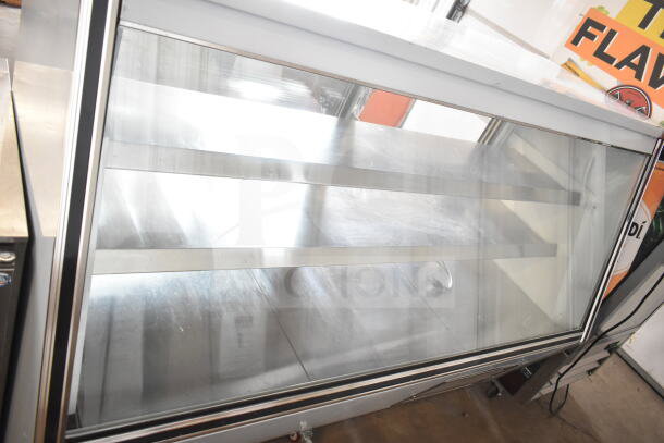 Optimum HD-72 deli display case, 120V, 1 Phase. Clear glass, metal shelves, floor style, commercial use, overall good condition.