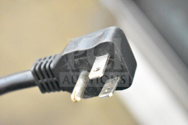 A close-up of an electrical plug for the Kool-it KB27RG Commercial Single Door Reach In Cooler, 115 Volts, 1 Phase.