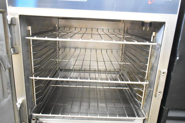 Alto Shaam 750-TH/III undercounter cook and hold oven, single door, on casters, 120V, 1 phase, clean interior, multiple racks.