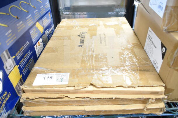 Three new 16"x24" cutting boards by Amazing, labeled "scratch and dent," in original packaging, with quantity tag "QTY 3."