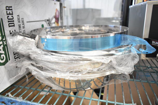 17 brand new scratch and dent items, including collar form and bowls, wrapped in plastic, ready for auction.