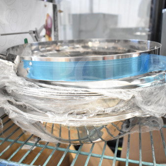 17 brand new scratch and dent items, including collar form and bowls, wrapped in plastic, ready for auction.