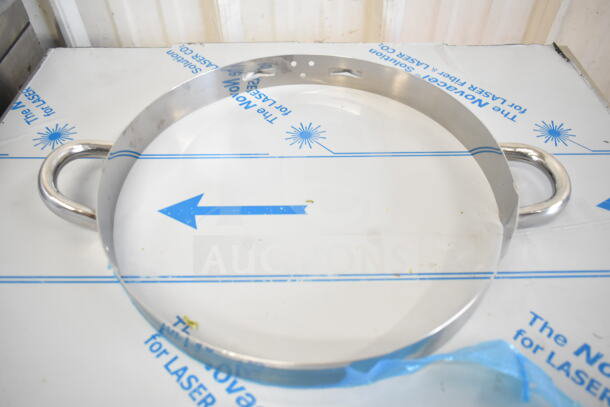 Stainless steel collar form, new, with dual handles, minor scratches. Suitable for various applications.