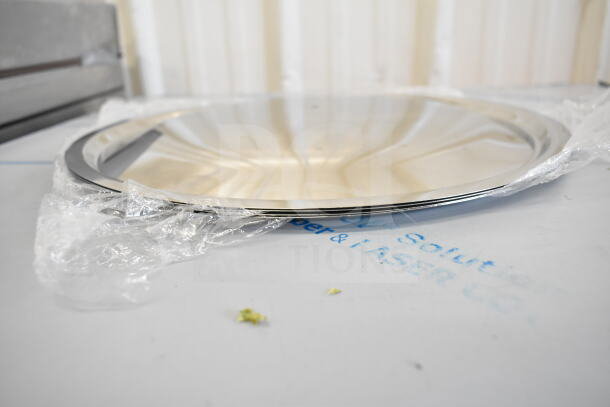 Chrome platter, part of 17 scratch and dent items, still in packaging. Shiny finish, minor imperfections noted.