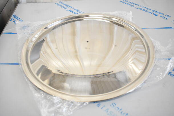 Silver bowl with reflective surface, part of 17 new scratch and dent items including collar form, in packaging.