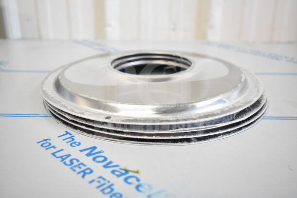 Stack of new metal bowls with minor scratches, suitable for laser fiber applications, labeled "Novacel for Laser Fiber."