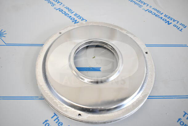 Circular metal disc with central opening, part of 17 new scratch and dent items, includes collar form and bowls.