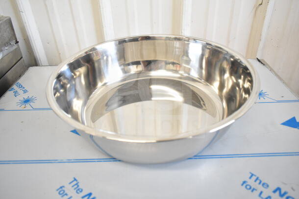 Shiny stainless steel bowl, brand new, slight scratch, part of a 17-item auction including collar form.
