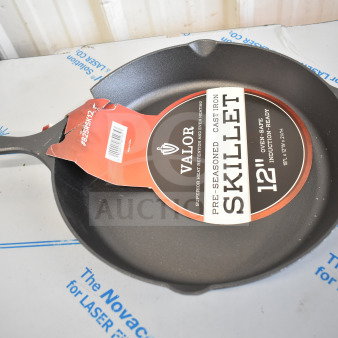 Valor 12" pre-seasoned cast iron skillet with helper handle, model 825RSK12. Brand new, scratch and dent condition.