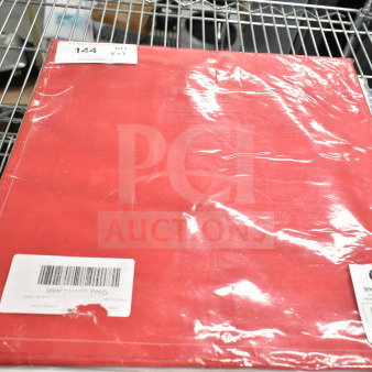Brand new Choice 15 13/16" x 15 13/16" red cotton dinner napkin, 25/pack, labeled 9996DNAPFLTRED, on shelf.