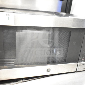 General Electric GE JES1657SM1SS countertop microwave oven, stainless steel, 120 volts, 1 phase, control panel visible.