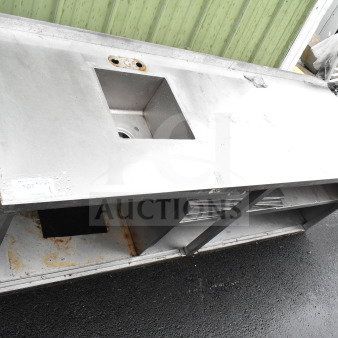 Commercial counter with sink bay and under shelf, stainless steel, moderate wear, rust on lower shelf, label reads "167."