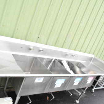 Commercial 4 bay stainless steel sink with dual drain boards, labels on bays, and sturdy legs, perfect for restaurant use.