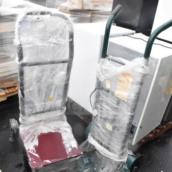 Two brand new furniture dollies wrapped in plastic and labeled "Scratch and Dent," indicating minor imperfections.