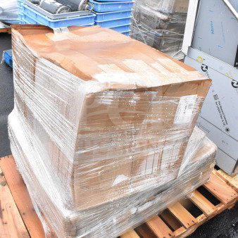 Wrapped pallet with new scratch-and-dent items including a table and armchair. Labeled “MAY26-88” for auction.