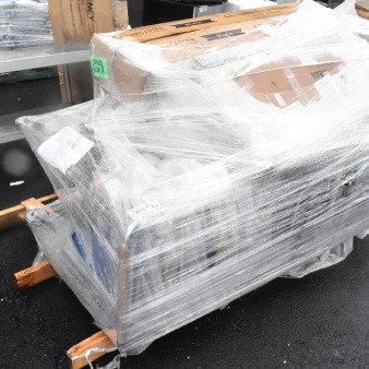 Plastic-wrapped pallet containing brand new scratch and dent items, including a grocery cart and evaporator coil. Tags indicate "Skid Lot 2."