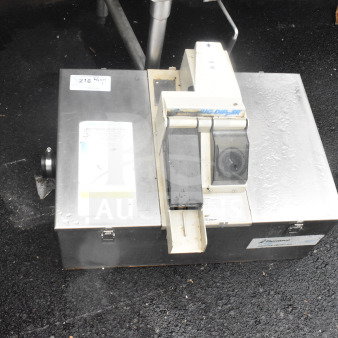 Thermaco Big Dipper grease interceptor in used condition, stainless steel, visible brand label, model details partially obscured.