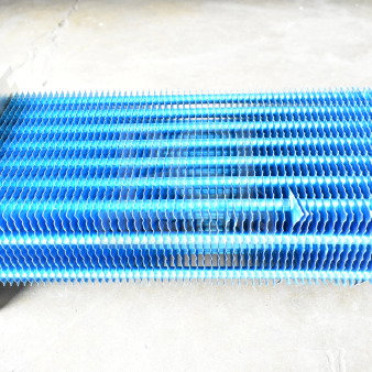 BRAND NEW 4R6K370L evaporator coil with visible scratch and dent; blue fins, metal frame; ideal for HVAC systems.
