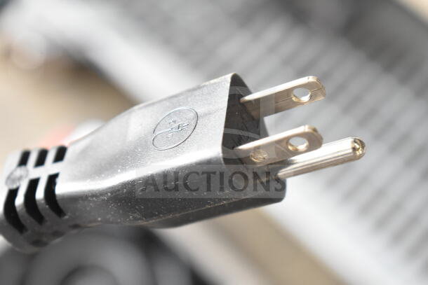 Alt text: Estella 348CG1NB electric cheese grater plug, 110 volts, visible power prongs, brand new scratch and dent condition.