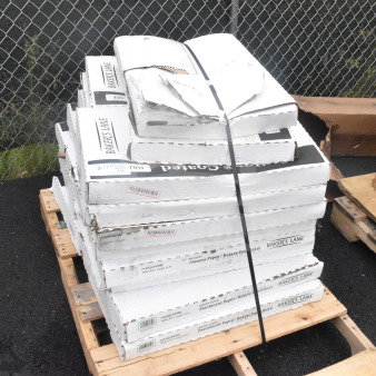 Stack of 16 brand new scratch and dent Baker's Lane 16" x 24" Quilon® coated parchment paper cases.