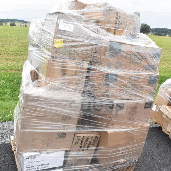 Shrink-wrapped pallet of 32 assorted scratch and dent items, including boxes of kitchenware and table covers.