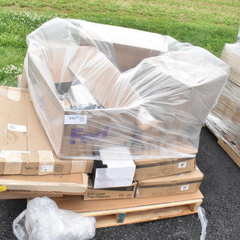 18 scratch and dent items on a pallet, including beverage glasses, bowls, and lids, wrapped in plastic. Multiple boxes visible.