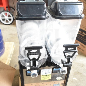 Carnival King Oasis 2-10 frozen beverage machine, 2.6-gallon capacity, pourover model, minor scratches, new condition.