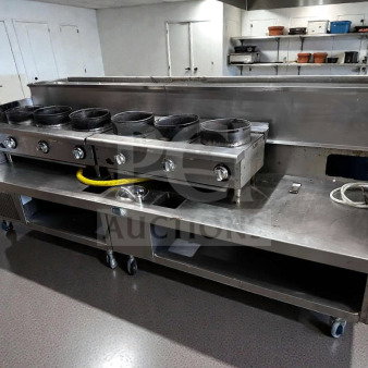 Commercial 6-burner stainless steel wok system, gas-operated, with refrigerated top and cold rail. Immaculate condition.