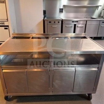 Stainless steel work table with under-cabinet storage, 57"x31"x38", mobile, exceptional condition, ready for commercial use.