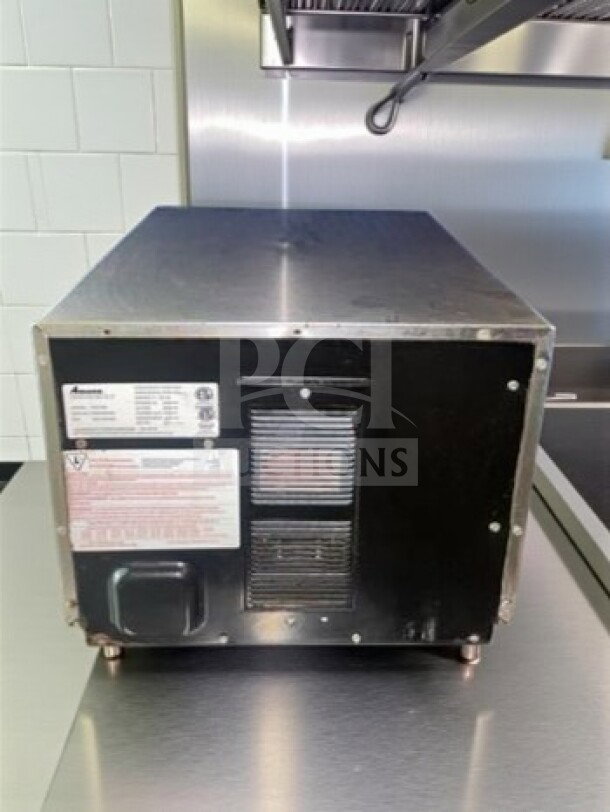 Amana HDC182 heavy-duty stainless steel commercial microwave, 0.6 cu. ft., 1800W, push button controls, ETL listed, rear view.