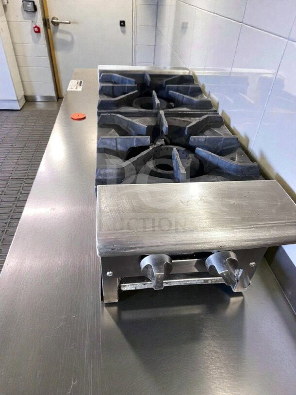 Stainless steel 2-burner gas hot plate with heavy-duty cast iron grates and manual controls. Excellent condition, fully tested.