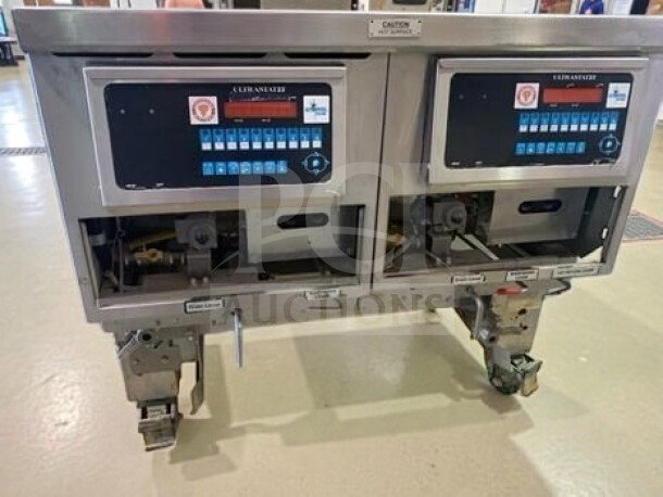 Ultrafryer Systems UltraGold 78" gas deep fryer, model B-P20-18-4-UC_NAT. Features 4 fry tanks, UltraClear filtration, 260,000 BTU. ENERGY STAR® and NSF/CSA listed. In elite condition.