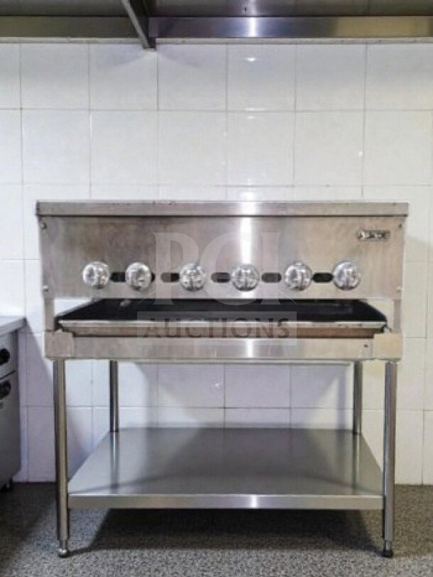 Prime condition Jade Range JB-36 gas charbroiler, 36", cast iron grates, stainless steel stand, 90,000 BTU, NSF/CSA listed.