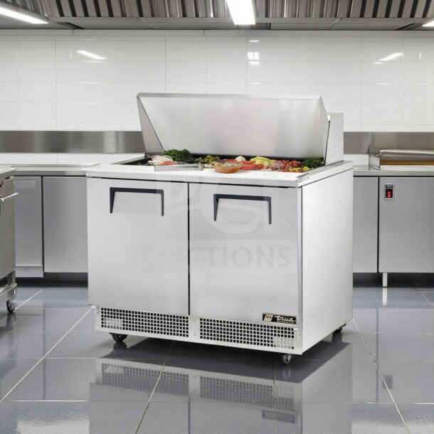 Brand new True TFP-48-18M-HC prep table, 48" wide, refrigerated base, 18-pan capacity, NSF/UL listed, fully operational.