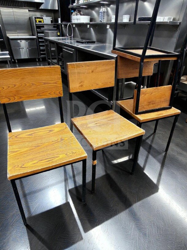 Set of 8 wood and metal dining chairs with wood seat and backrest, black metal frame, well-maintained, ready for use.