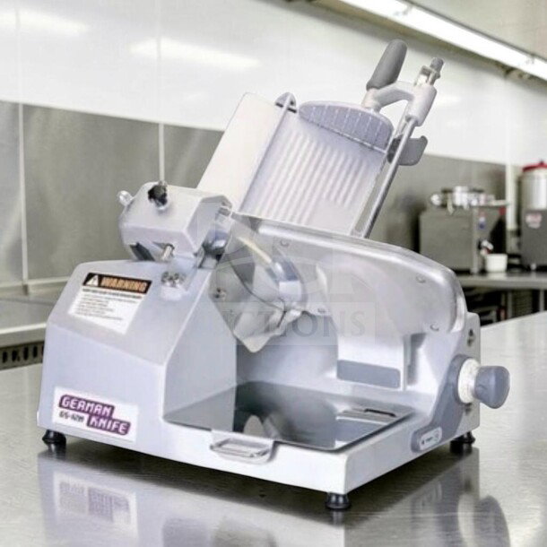 German Knife GS-12M slicer, 12" blade, gravity feed, manual, 1/2 HP, in exceptional condition, UL & NSF approved.
