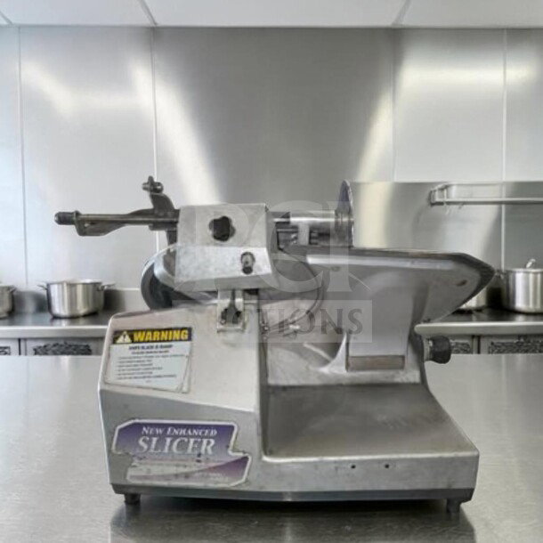 German Knife GS-12M 12" slicer in exceptional condition. Features gravity feed, 1/2 HP motor, UL & NSF certified. Fully operational.
