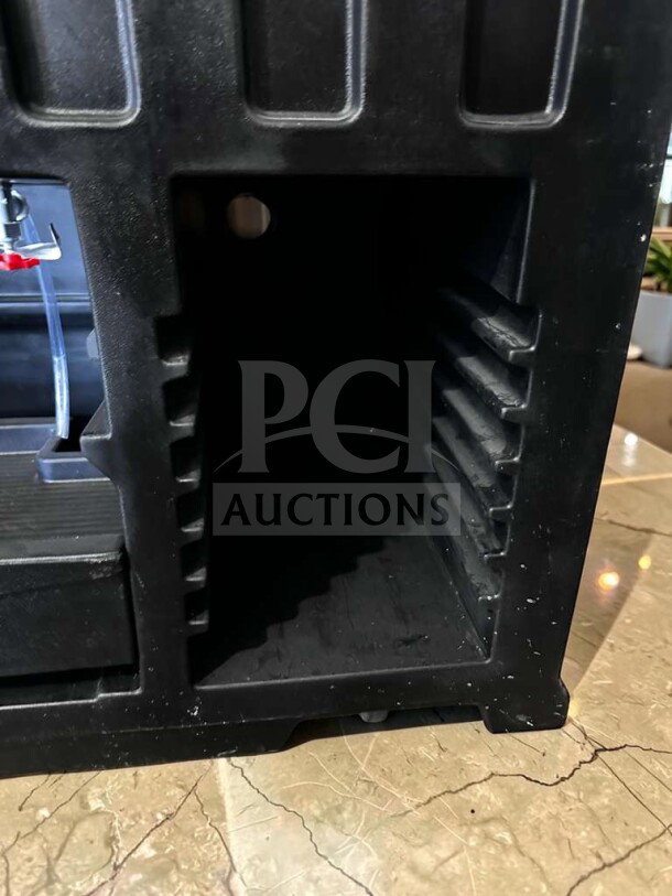 Black Cambro BAR540110 Cambar® portable bar, features ice bin, 55" width, top-tier condition, tested and operational.