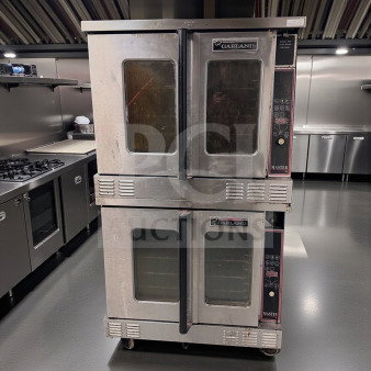 Two Garland Master 450 gas convection ovens, stainless steel, excellent condition, full-size, single deck, 120V/gas, fully tested.