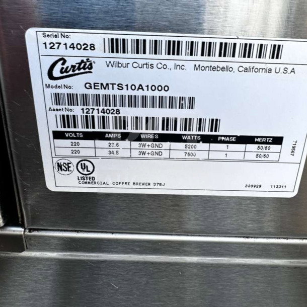 Wilbur Curtis GEMTS10A1000 label, 220V, NSF UL listed, commercial coffee brewer with serial and asset numbers.