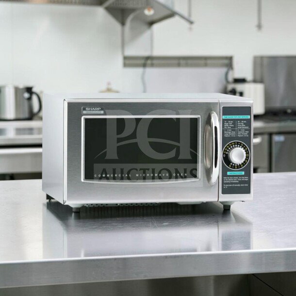 Sharp R-21LCFS commercial microwave oven, stainless steel, 1000W, dial control, excellent condition, fully tested operational.